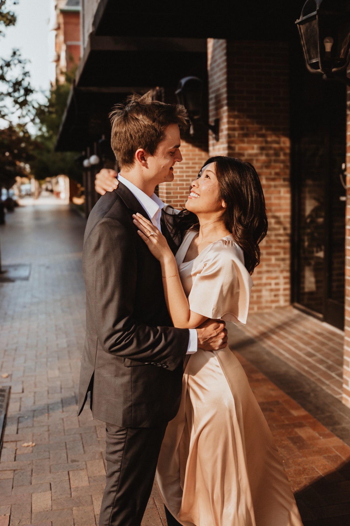 Yume and Christopher embracing on a Boise sidewalk