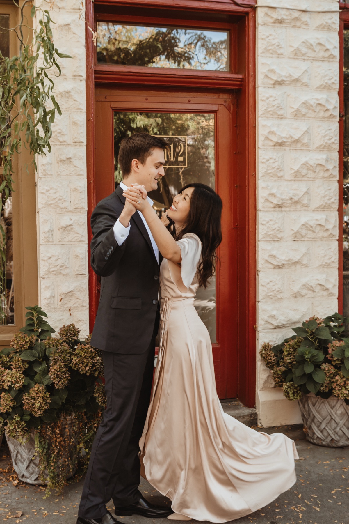 Dancing in front of a red door in downtown Boise